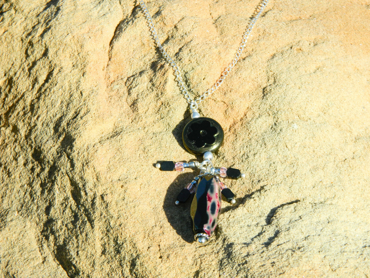 Necklace NK Jet Black Czech Pendant with a Faceted Jet Black tubular gemstone and accent drops surrounded on pendant on a Sterling Silver Chain