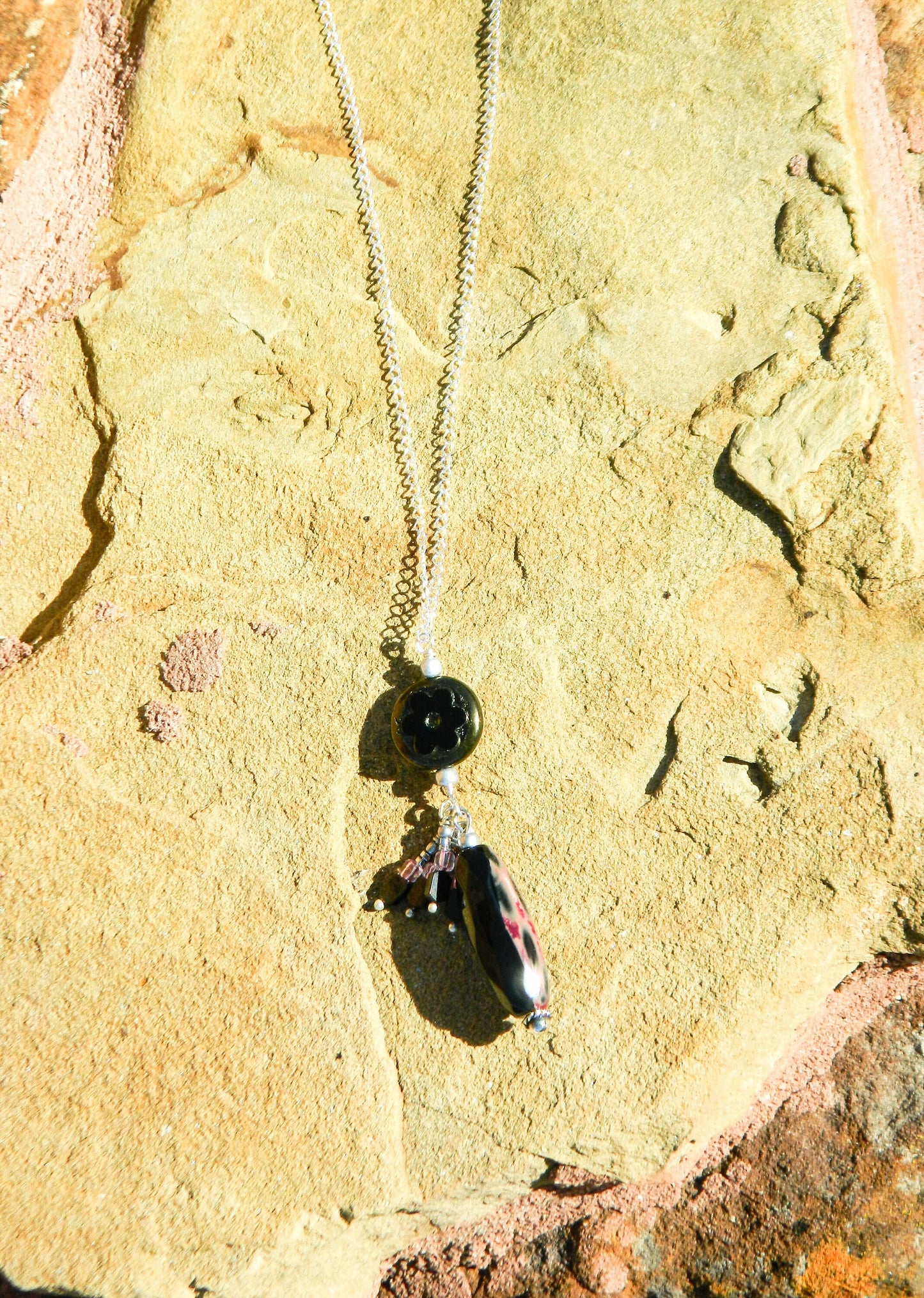 Necklace NK Jet Black Czech Pendant with a Faceted Jet Black tubular gemstone and accent drops surrounded on pendant on a Sterling Silver Chain