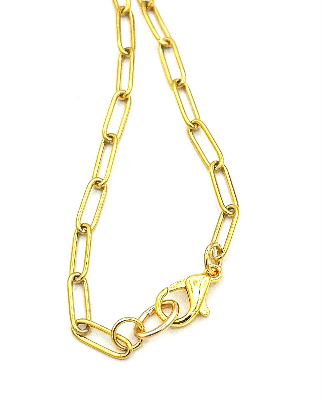 Heart Pendant Necklace: Gold plated Clasp, Paper Clip Chain, with a large rose quartz heart