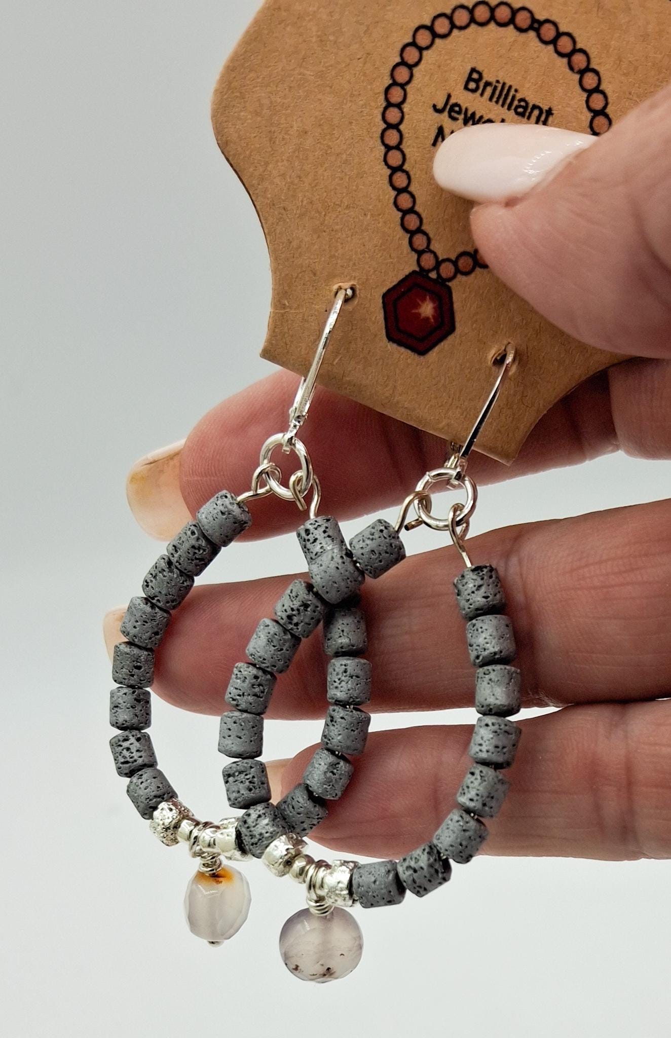 Nk Grey colored plated Hematite hoop earrings with a faceted Agate drop